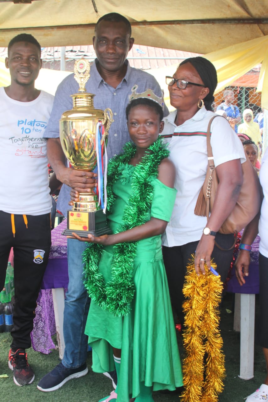 Young athlete receiving a trophy at NIPCO-sponsored event
